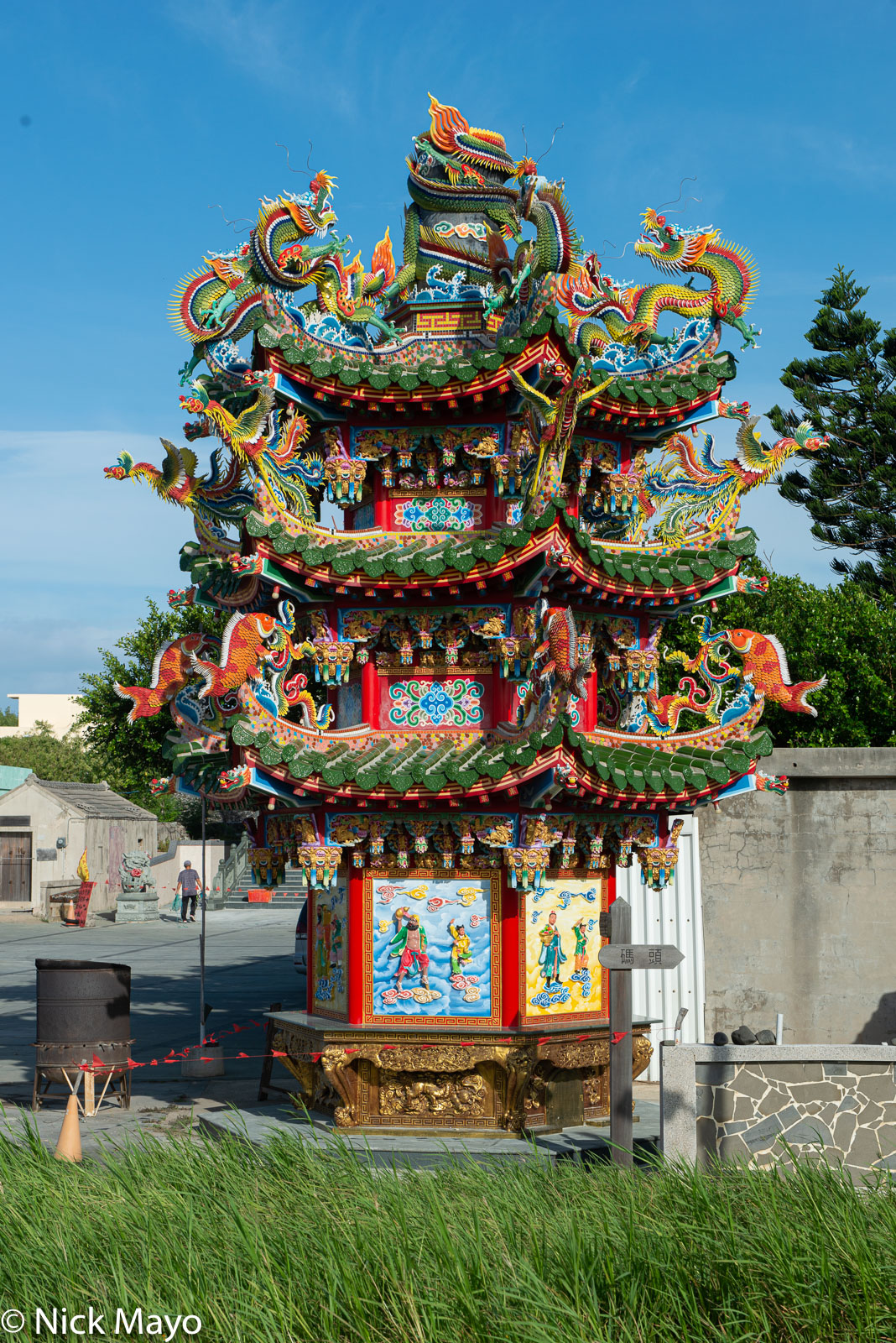 A richly decorated tower at an Erkan temple where paper offerings are burnt to bring luck.