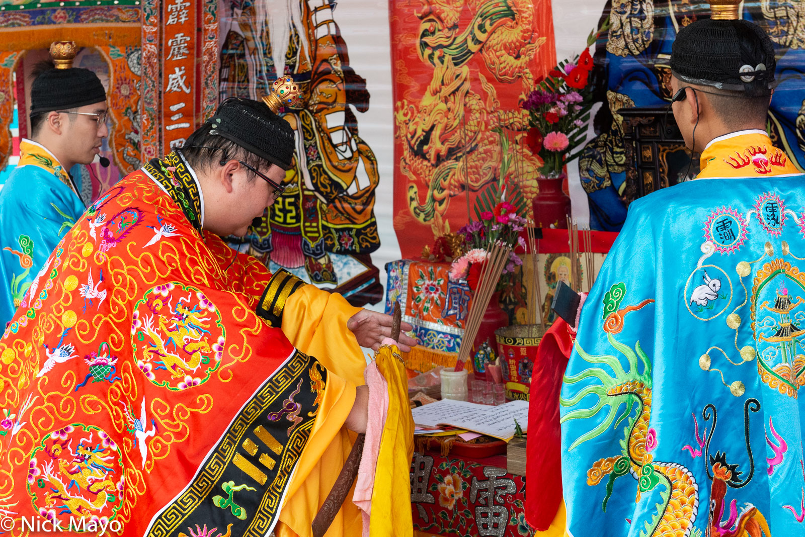 Priests performing a religious ritual at a temple festival in Linkou.