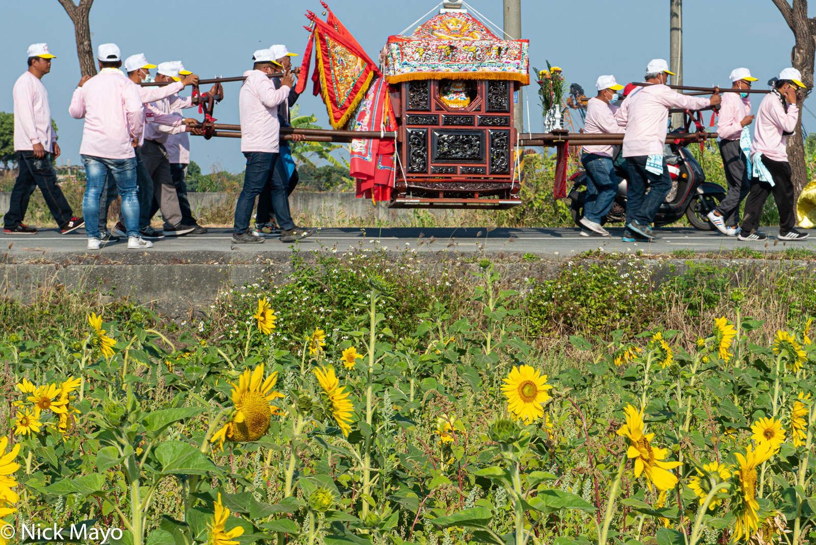 A palanquin being carried in a procession at a temple festival in Jhongjhou in Kaohsiung County.