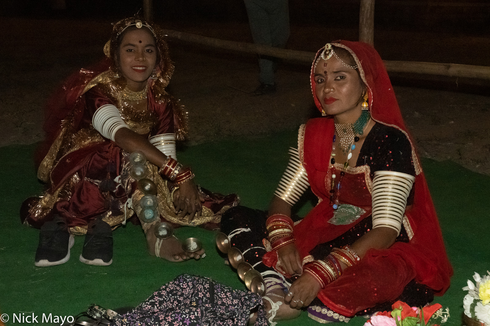 Two dancers waiting to take the stage during the evening performances of the Bundi Festival.