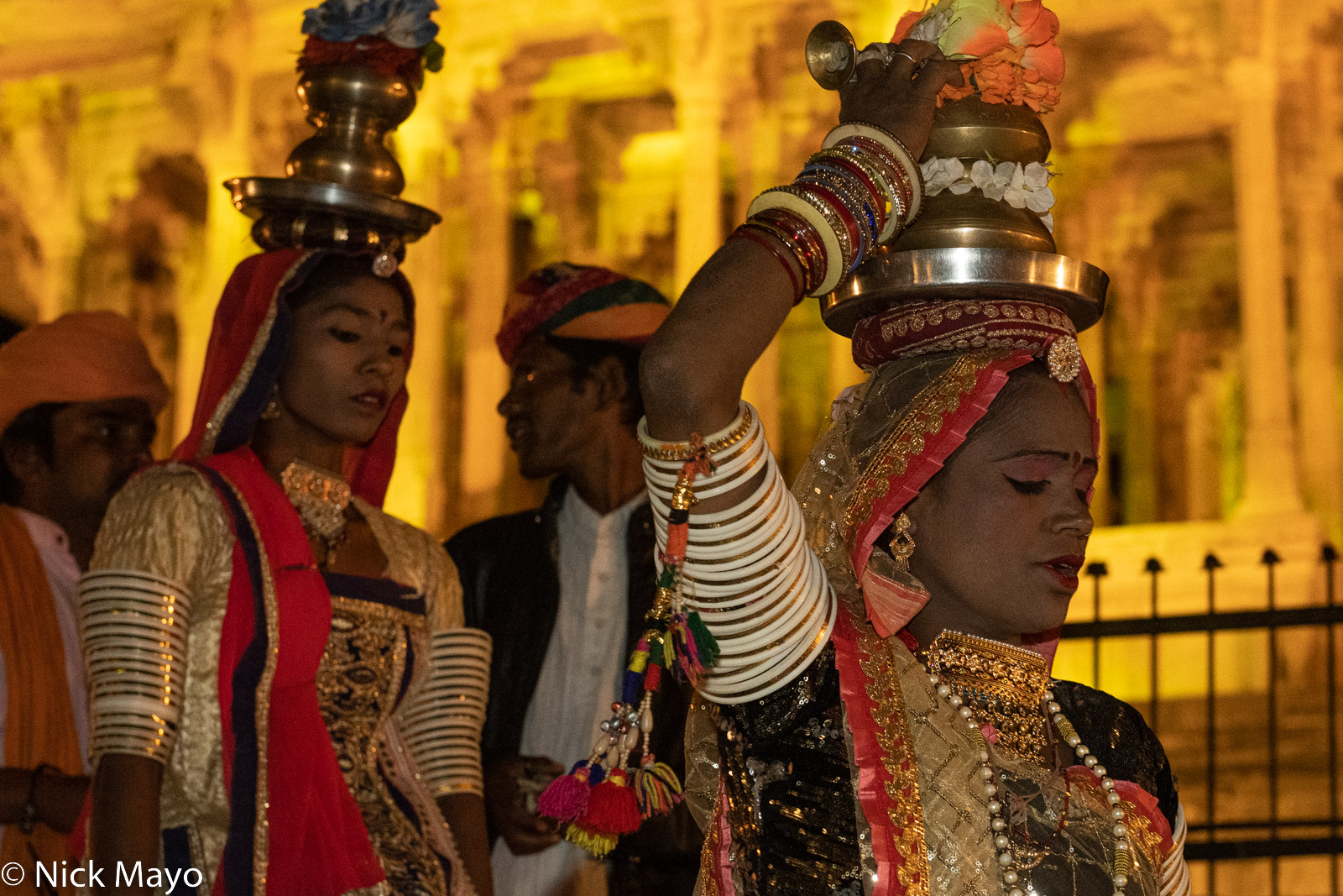 Two dancers leaving the stage during evening peformances at the Bundi Festival.