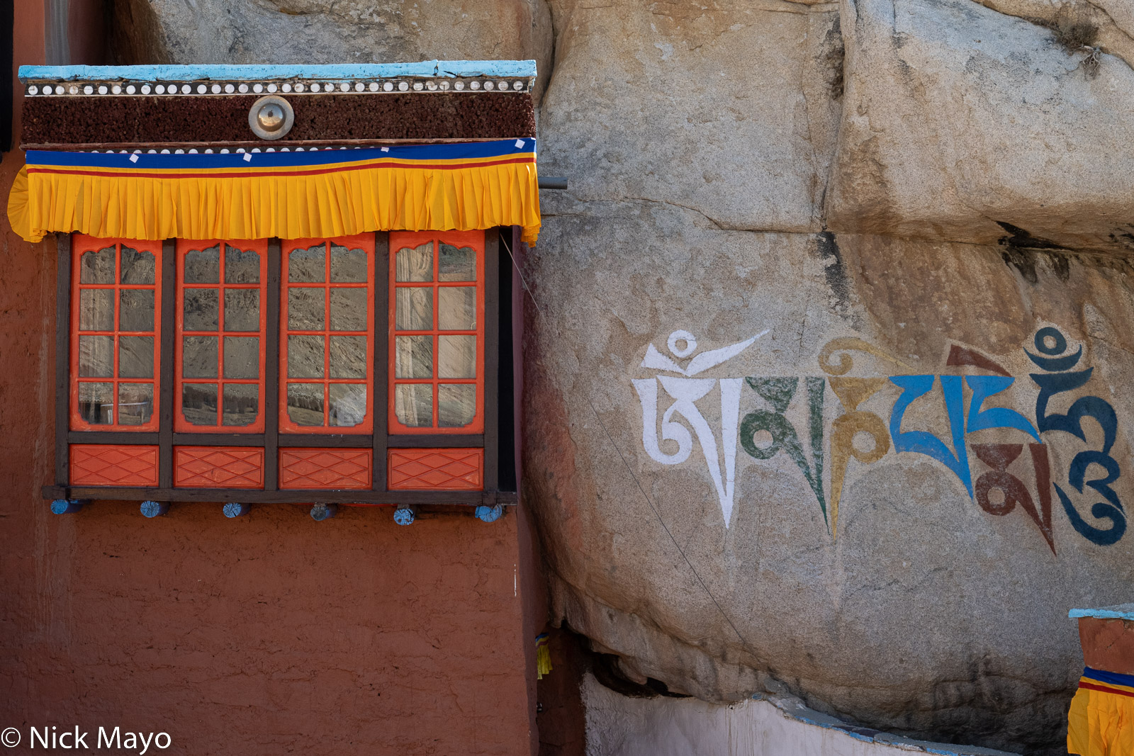 The mantra at the heart of many Buddhist traditions, Om Mani Padme Hum, painted on a rock at the Takthok monastery in Sakti.