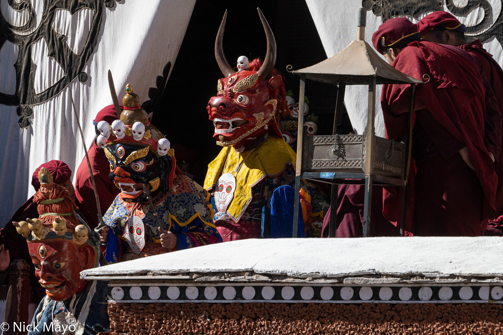 Masked monks descending to the courtyard of Hemis monastery to perform in the winter cham dances.