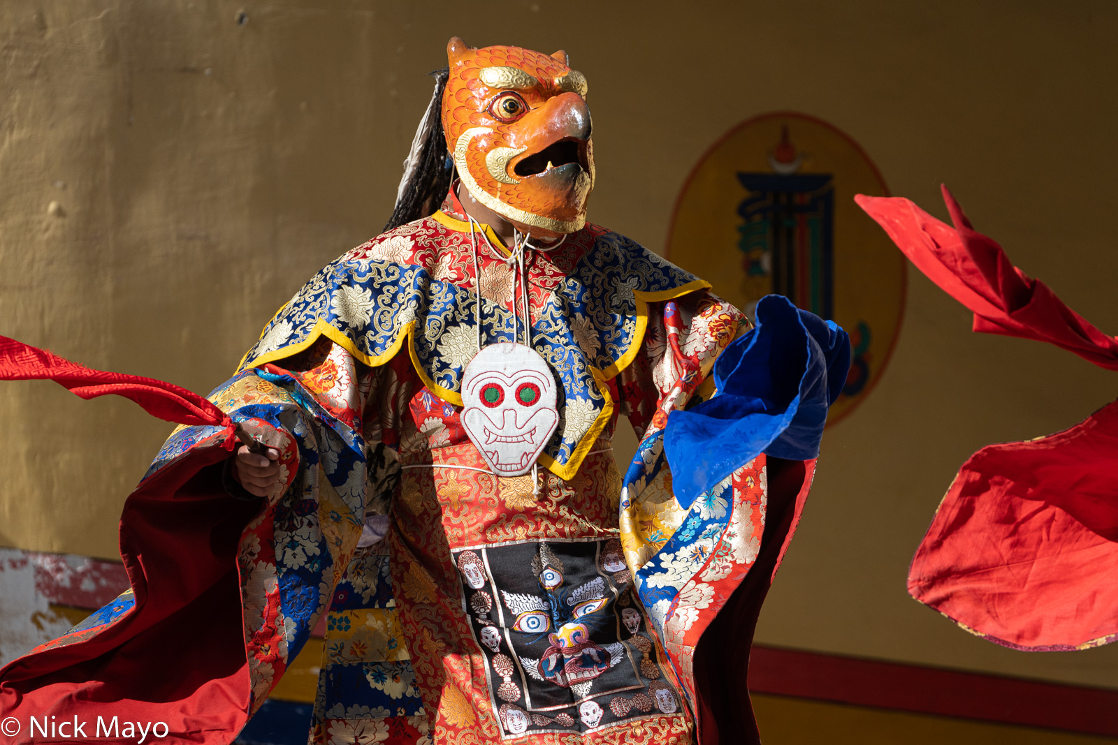 A monk with a bird mask dancing during the winter festival at Hemis monastery.