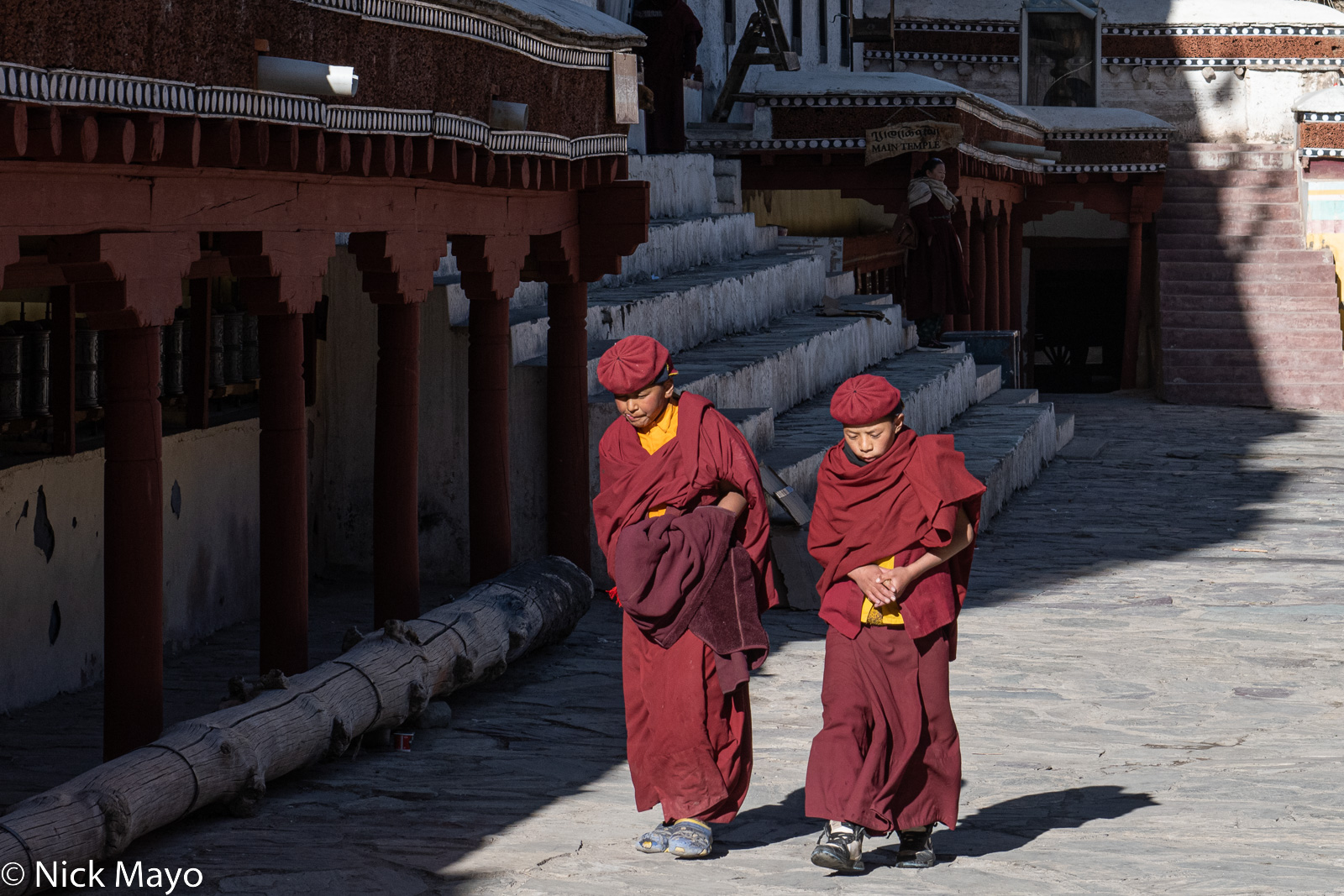 Two novice monks at Hemis monastery on a cold winter day.